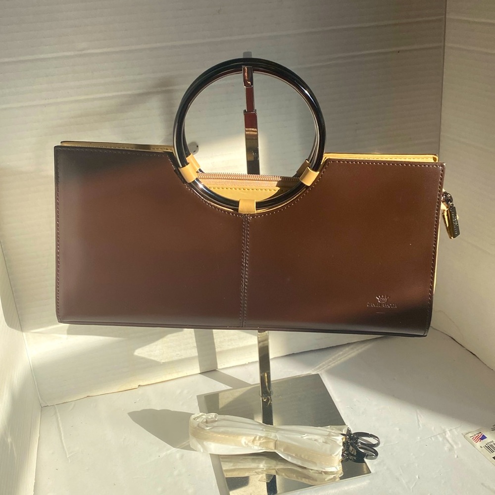 NWOT. Daniela Moda brown, genuine, leather clutch purse.